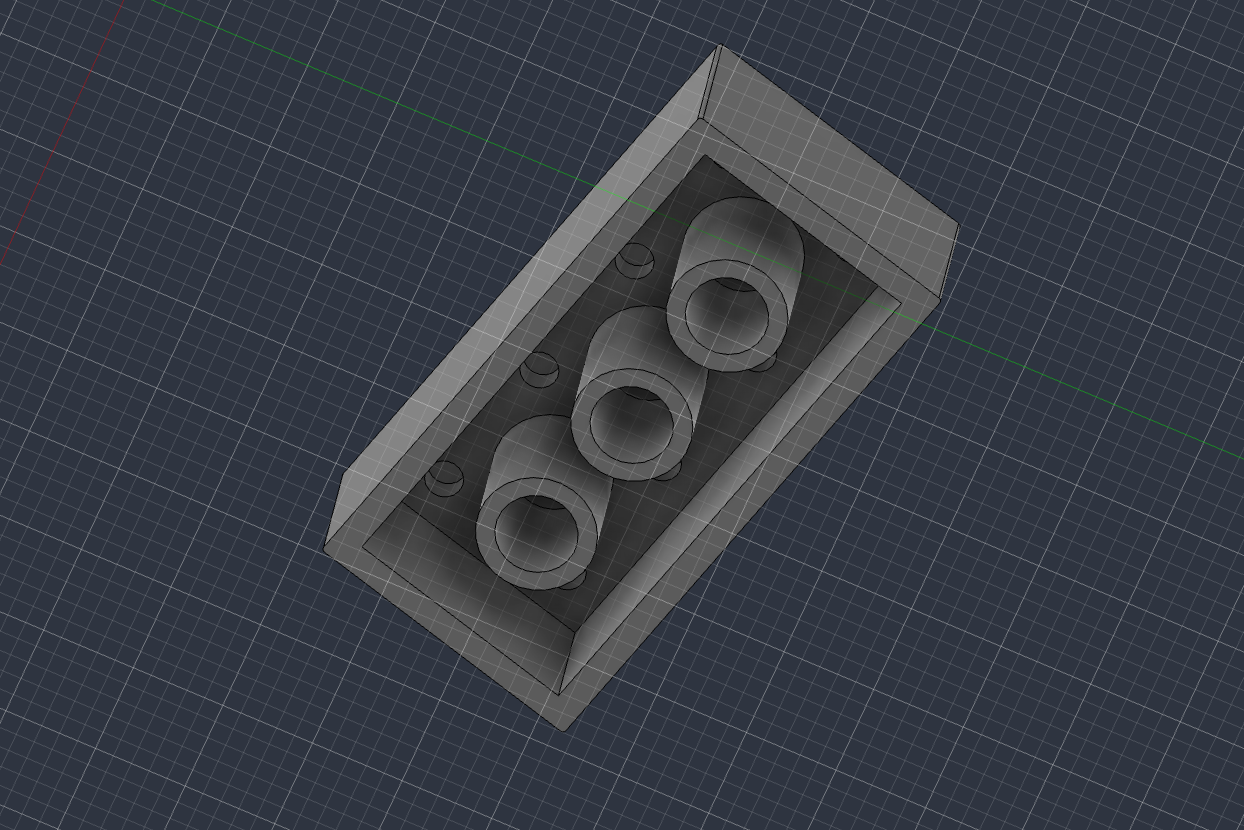 The same toy block viewed from below, showing the open underside, the surrounding walls, and three hollow cylindrical tubes running down the middle